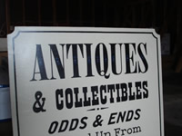 detail of antiques sign